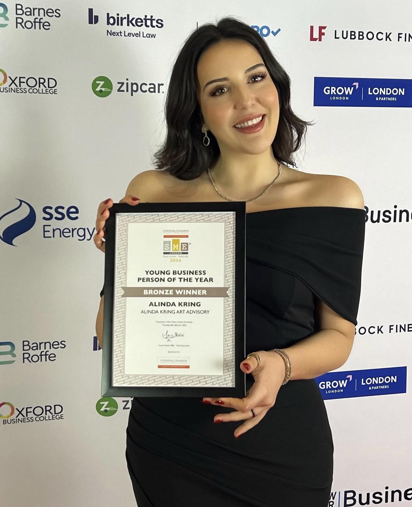 Alinda Kring holding her Young Business Person of the Year certificate at the SME London Business Awards 2024